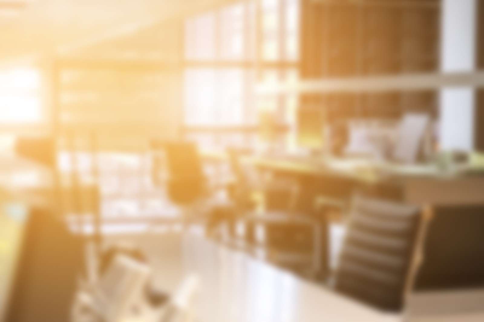 Blurred sunlit office interior